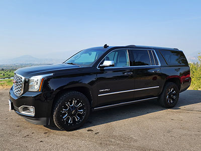 Our large GMC XL Denali SUV is great for transportation in all weather.